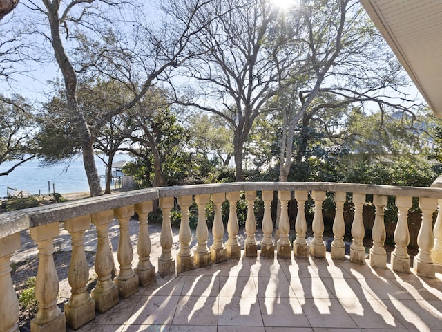 wooden deck featuring a water view