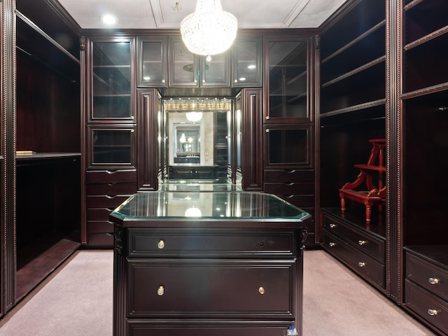 walk in closet with light colored carpet