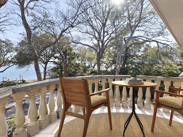 balcony featuring a water view