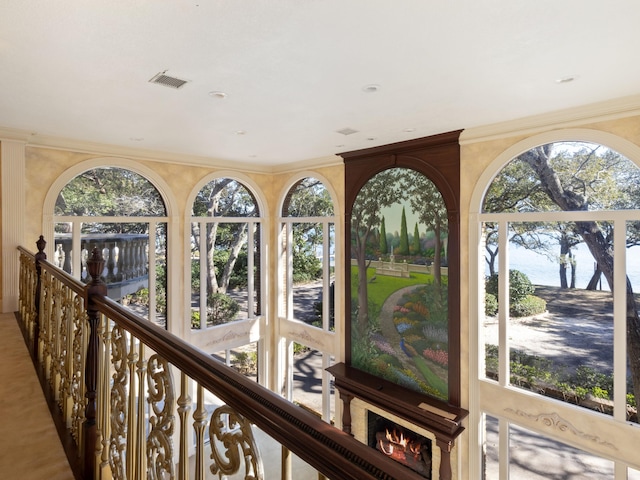 interior space with visible vents and ornamental molding