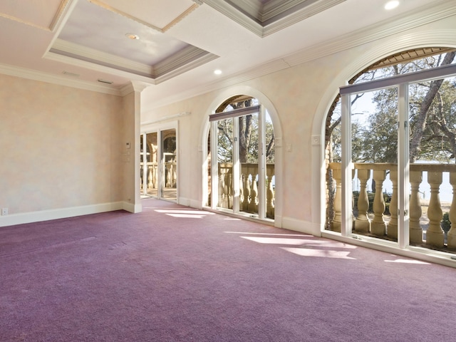 carpeted empty room with a raised ceiling, recessed lighting, baseboards, and ornamental molding