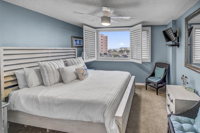 carpeted bedroom with baseboards, a textured ceiling, and ceiling fan