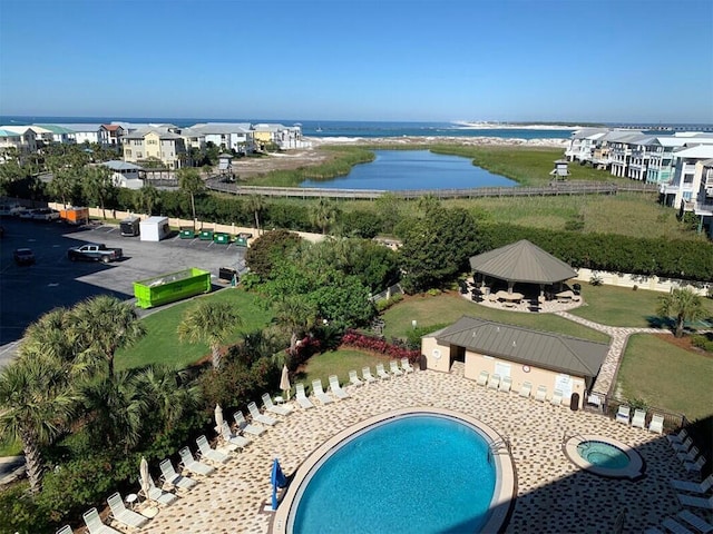 birds eye view of property featuring a water view