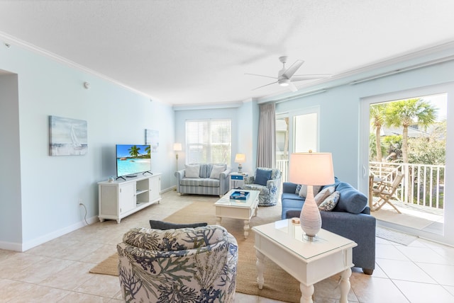 living area featuring baseboards, light tile patterned flooring, ceiling fan, a textured ceiling, and crown molding