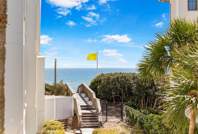 water view featuring stairway and fence