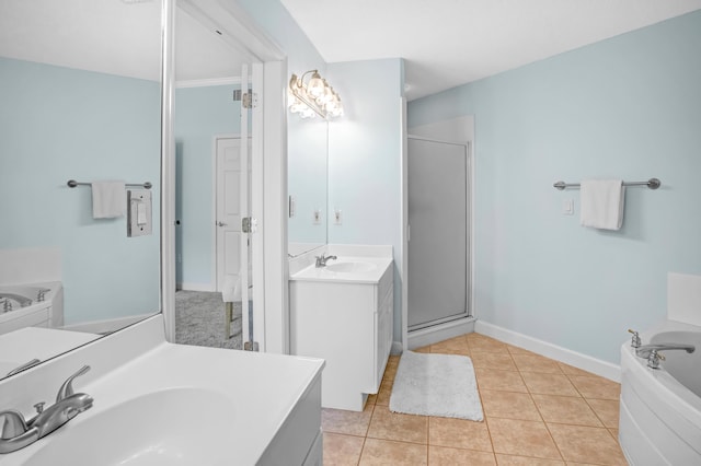 full bathroom featuring tile patterned floors, a shower stall, two vanities, and a sink