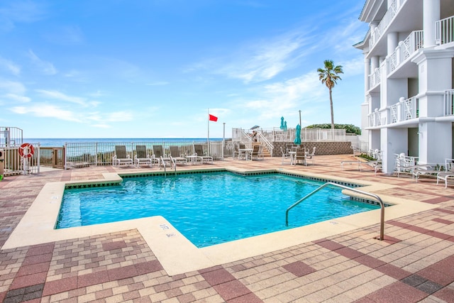 pool featuring a patio area and fence