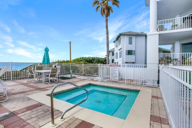 view of pool featuring outdoor dining space, a patio, and fence