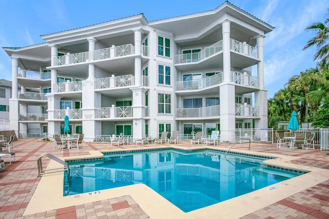 view of pool featuring a patio area and fence