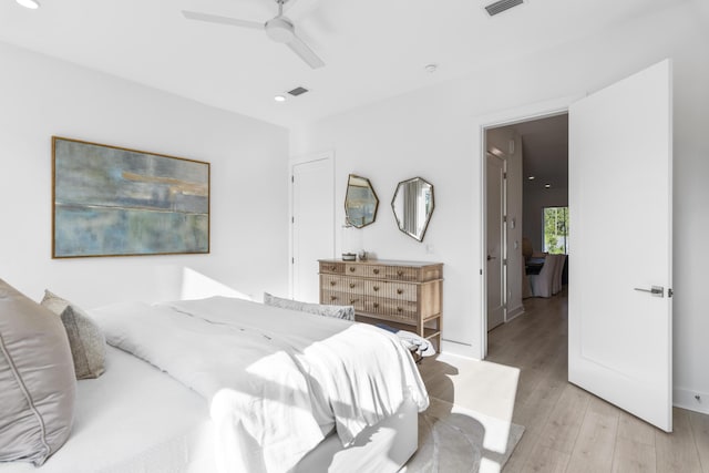 bedroom featuring recessed lighting, a ceiling fan, baseboards, and light wood finished floors