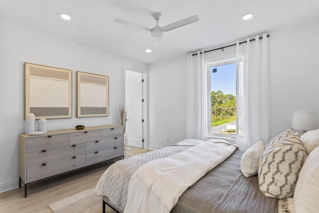 bedroom featuring ceiling fan, recessed lighting, light wood-type flooring, and baseboards