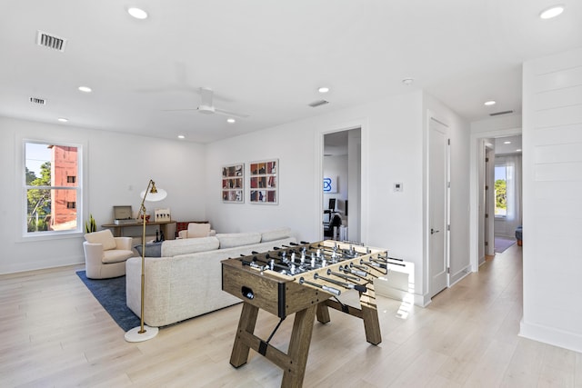 game room with a ceiling fan, recessed lighting, and light wood-type flooring