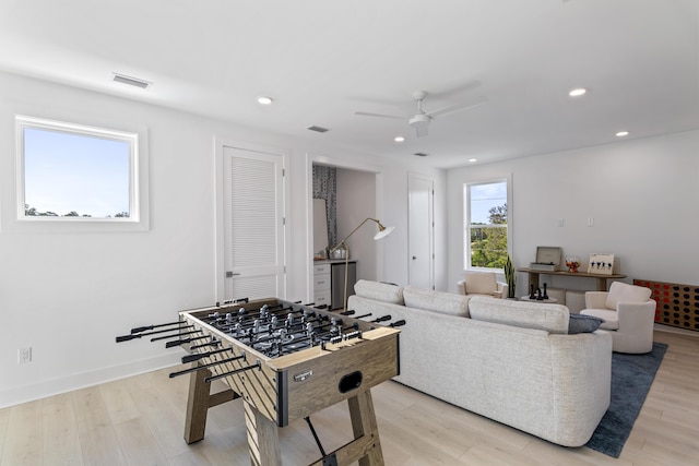 playroom with recessed lighting, visible vents, and light wood-type flooring