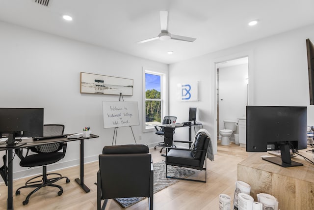 office featuring light wood finished floors, recessed lighting, baseboards, and a ceiling fan