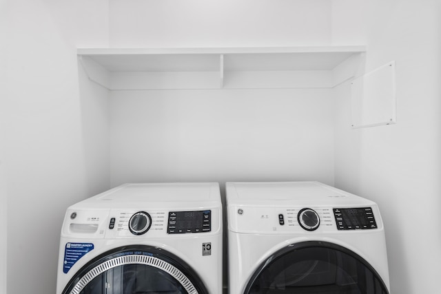 clothes washing area with laundry area and washing machine and dryer