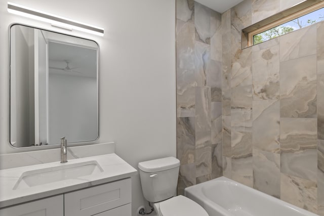 bathroom with shower / bathtub combination, vanity, toilet, and a ceiling fan