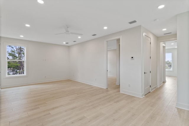 spare room featuring recessed lighting, visible vents, light wood-style flooring, and a ceiling fan