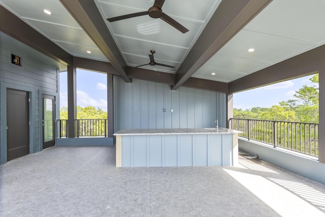 view of patio featuring ceiling fan