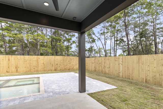 view of yard featuring a patio area and a fenced backyard