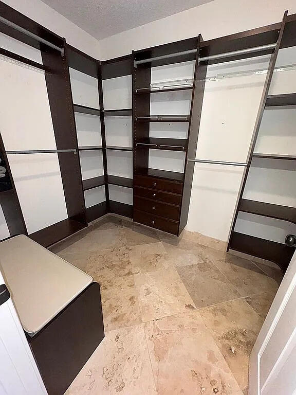 spacious closet with a barn door