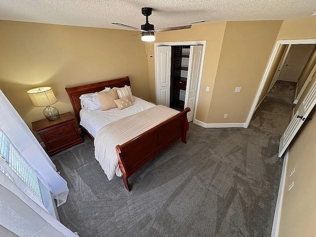 bedroom with baseboards, visible vents, carpet floors, a closet, and a textured ceiling