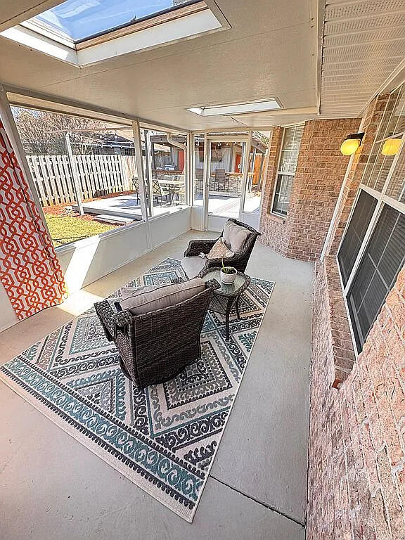 view of patio / terrace featuring an outdoor hangout area and fence