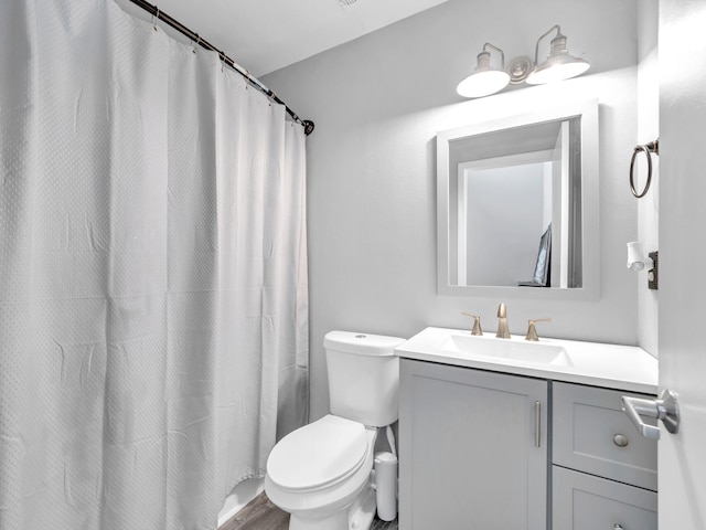 full bathroom with vanity and toilet