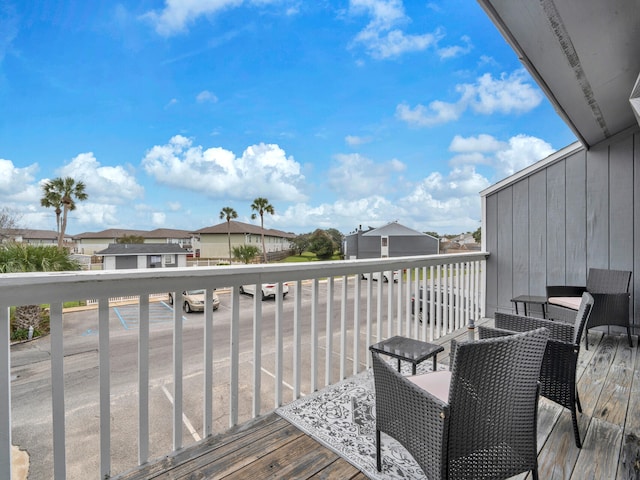 wooden terrace featuring a residential view