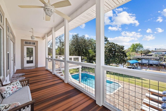 4077 N Indian Byu, Destin, FL 32541 - unfurnished sunroom featuring a ceiling fan and a water view
