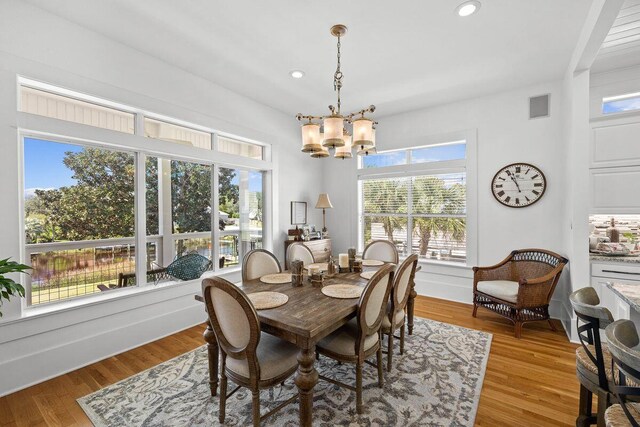 4077 N Indian Byu, Destin, FL 32541 - dining area featuring a chandelier, plenty of natural light, recessed lighting, and light wood finished floors