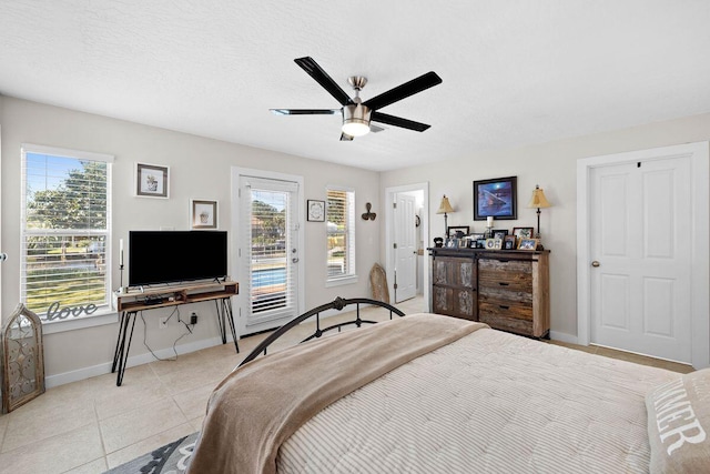 4077 N Indian Byu, Destin, FL 32541 - bedroom with access to exterior, baseboards, light tile patterned floors, and multiple windows