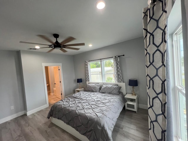 bedroom featuring visible vents, recessed lighting, wood finished floors, and baseboards