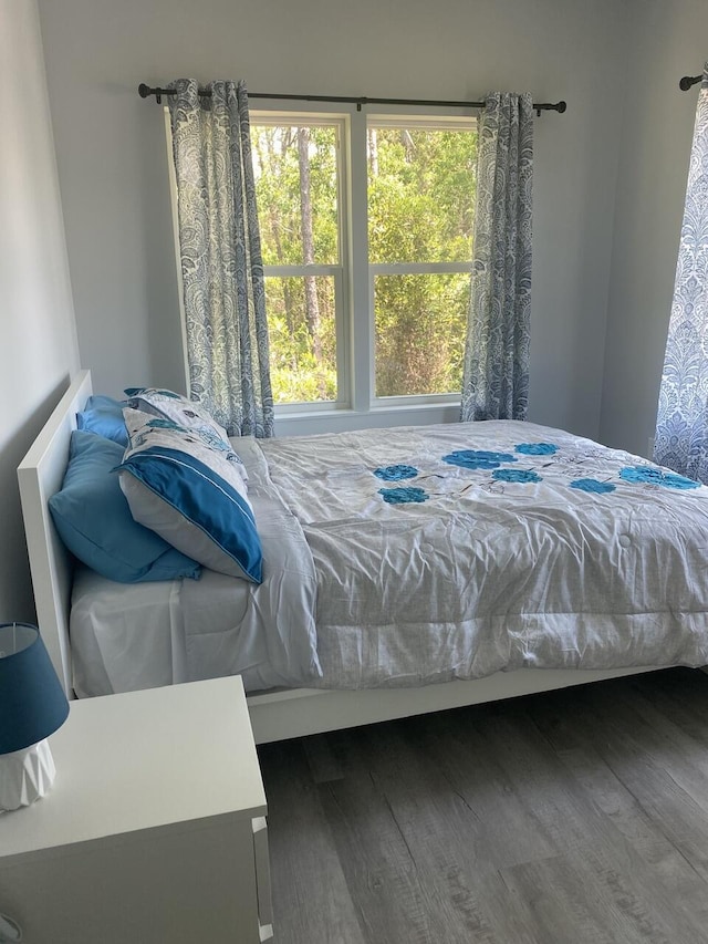 bedroom with wood finished floors