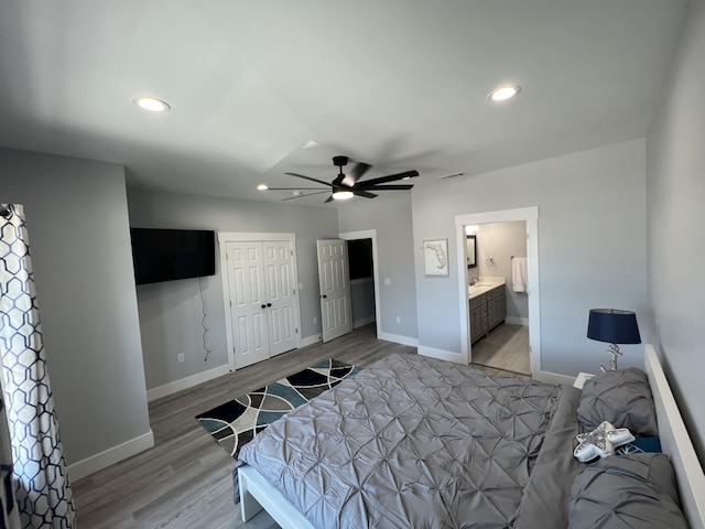 bedroom with visible vents, recessed lighting, light wood-type flooring, and baseboards