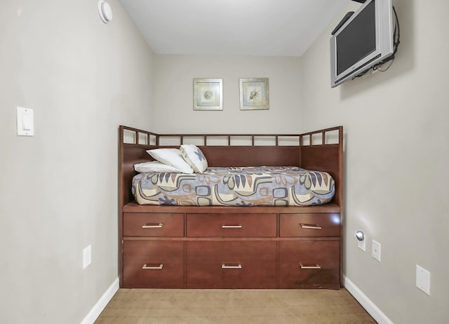 bedroom featuring baseboards