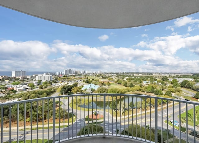 balcony featuring a view of city and a water view