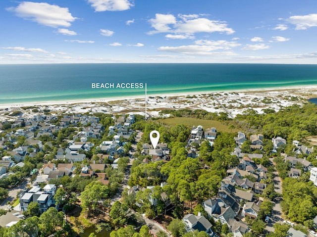 birds eye view of property with a view of the beach, a water view, and a residential view