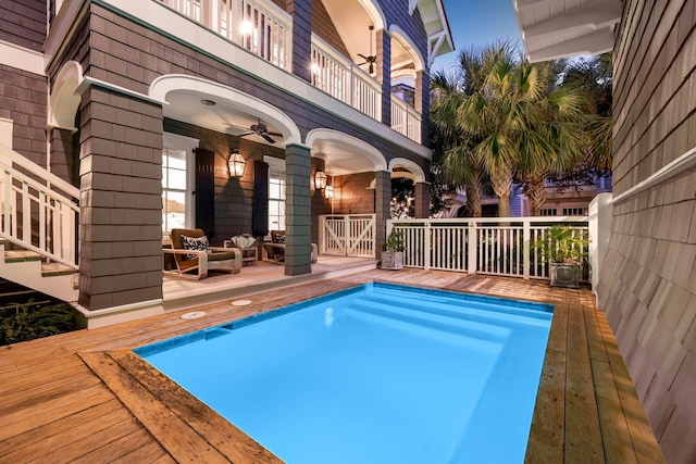 outdoor pool with ceiling fan