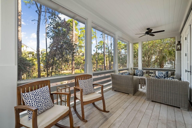 sunroom featuring wooden ceiling, a wealth of natural light, and ceiling fan