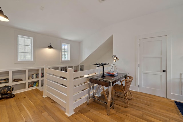 staircase with wood finished floors