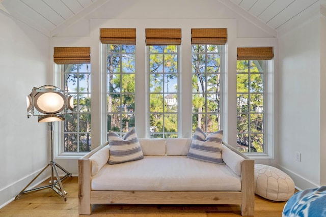 sunroom featuring vaulted ceiling