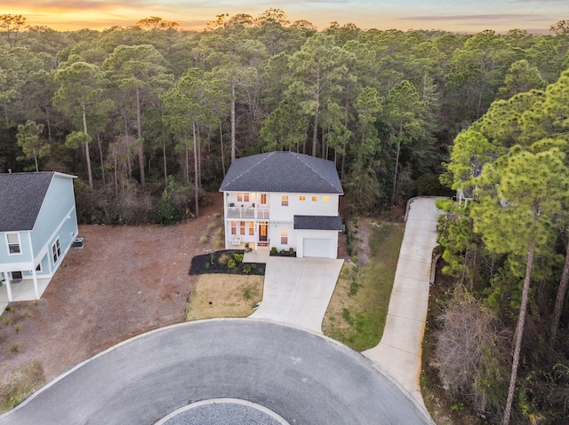 aerial view at dusk with a forest view