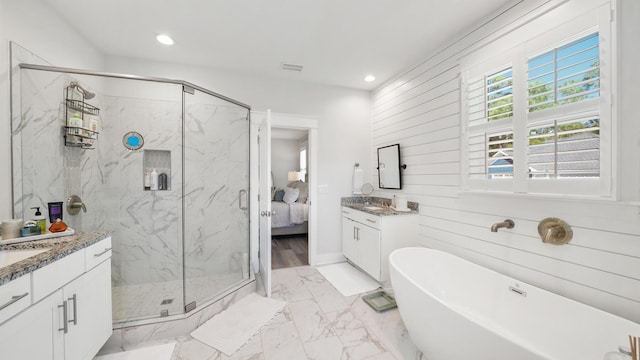 ensuite bathroom with vanity, ensuite bathroom, marble finish floor, and a marble finish shower