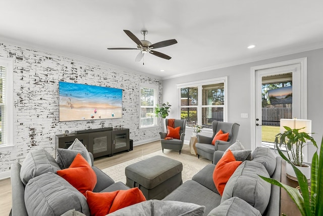 living room featuring recessed lighting, wood finished floors, baseboards, a ceiling fan, and crown molding
