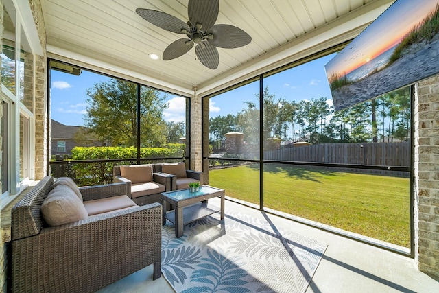 sunroom / solarium with a ceiling fan and a wealth of natural light