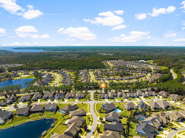 bird's eye view with a residential view, a water view, and a forest view
