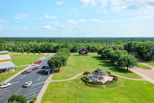birds eye view of property with a view of trees