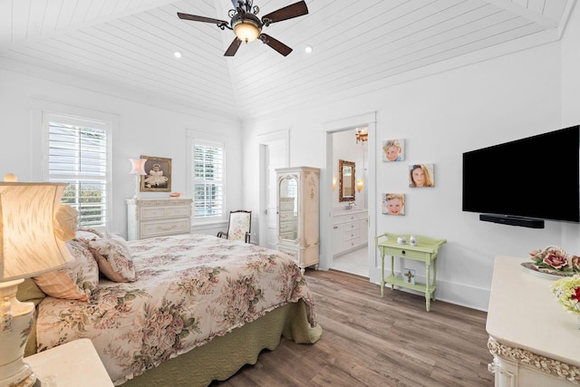 bedroom with a ceiling fan, baseboards, light wood finished floors, vaulted ceiling, and wooden ceiling