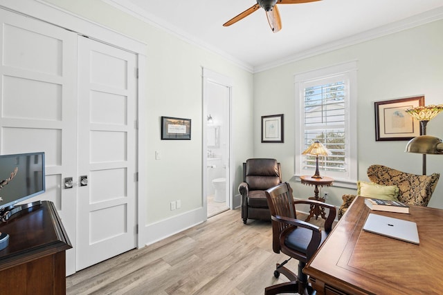 office with light wood-style flooring, baseboards, a ceiling fan, and ornamental molding