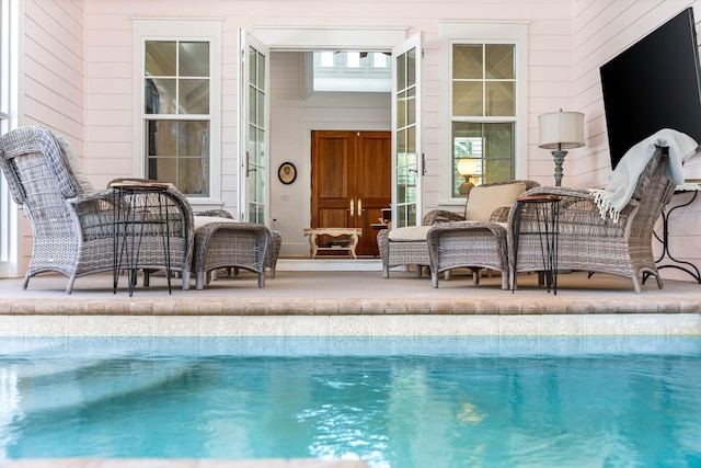 outdoor pool featuring a patio